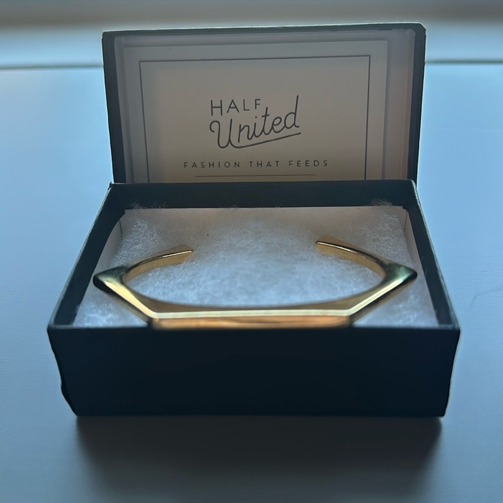 Half United gold colored bracelet.